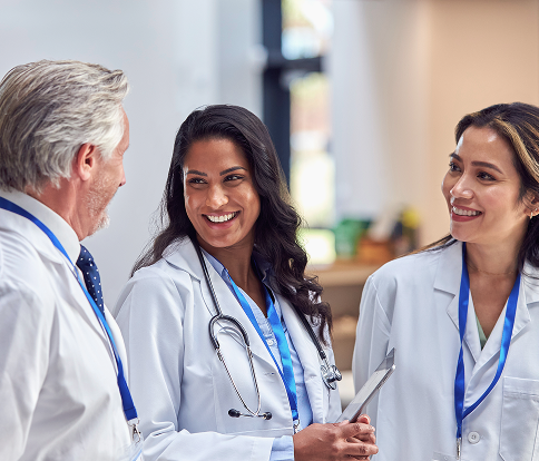 Smiling physician with a laptop